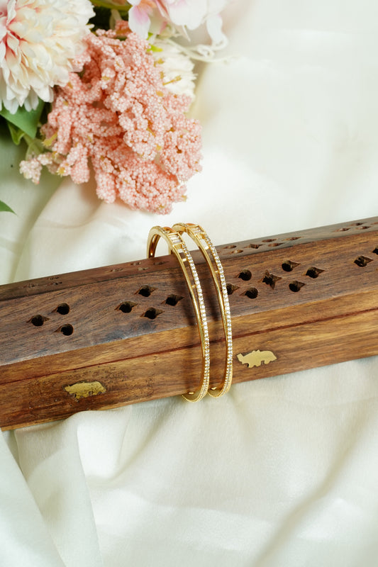 Wave cross bangle